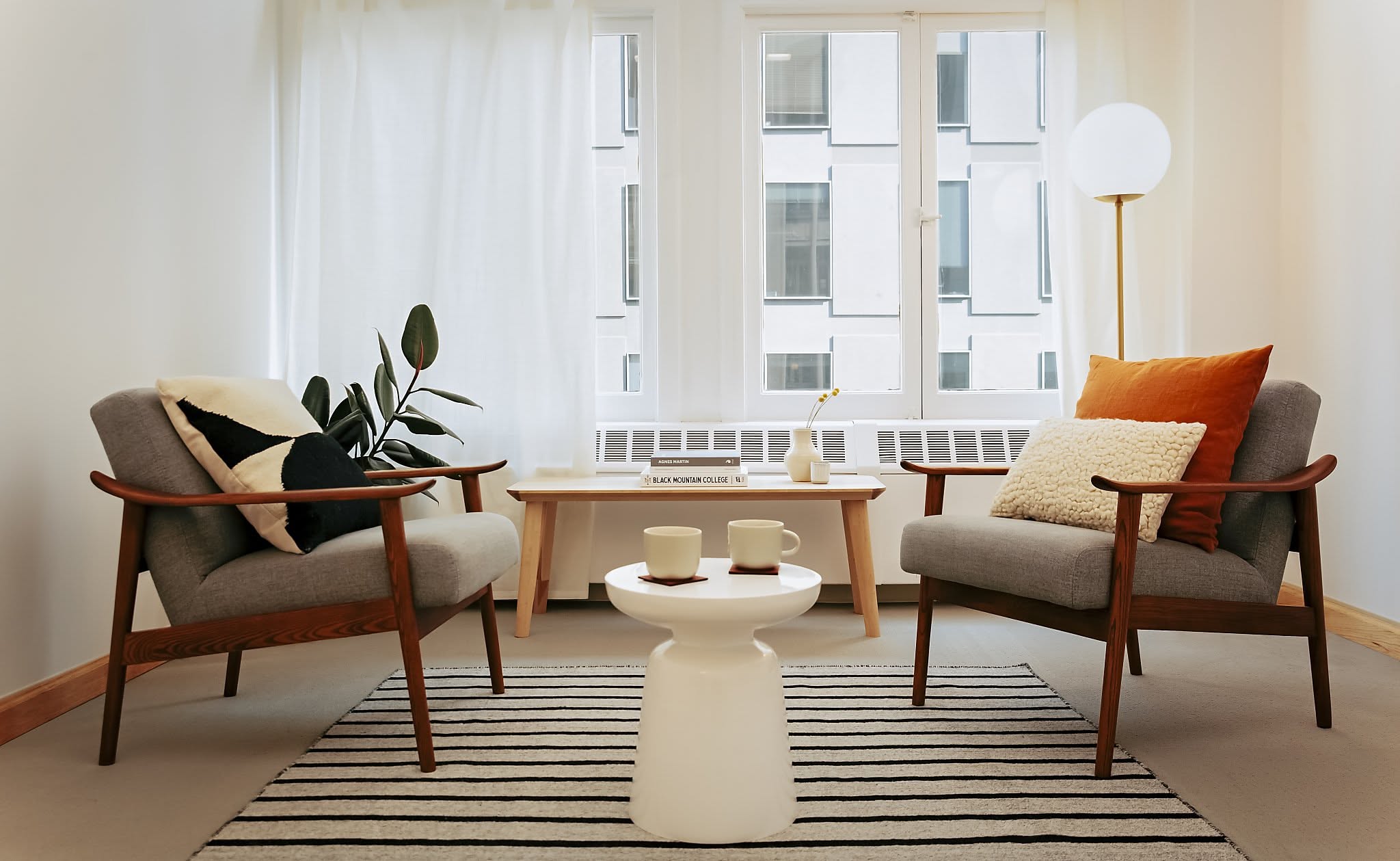 A cosy therapy room with two comfortable chairs